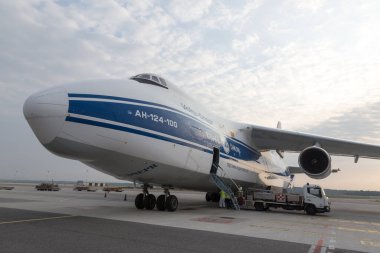 MALPENSA AIRPORT, ITALY - SEPTEMBER 14, 2021: The Huge Antonov 124-100 during loading operations, before the take off