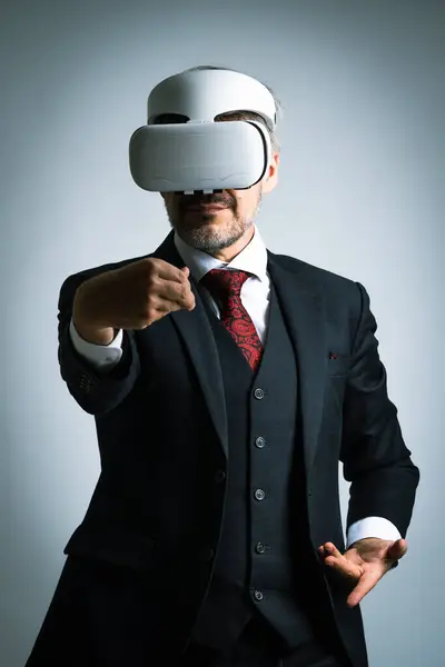 Businessman wearing VR goggles using metaverse technology innovation to Taichi exercise, Digital business concept. AR Concept over isolated white background, Augmented reality technology futuristic.