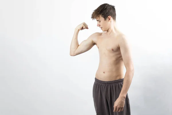 Year Old Shirtless Muscular Teenage Boy Flexing His Arm Muscles — Stockfoto