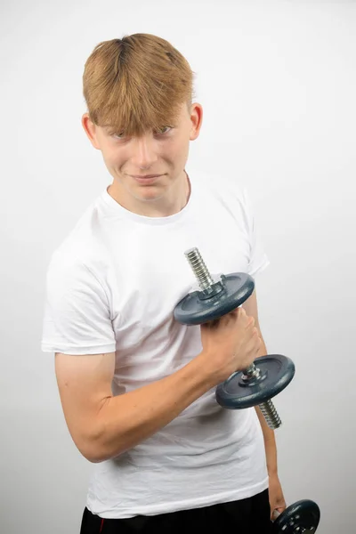 Portrait Year Old Caucasian Teenage Boy Using Dumbbell Looking Forward — Stock Photo, Image