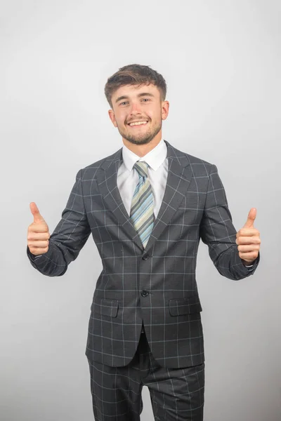Portrait Young Entrepreneur Suit Tie Giving Thumbs Plain Background — Stock Photo, Image