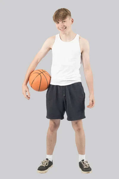 stock image Caucasian teenage boy holding a basketball