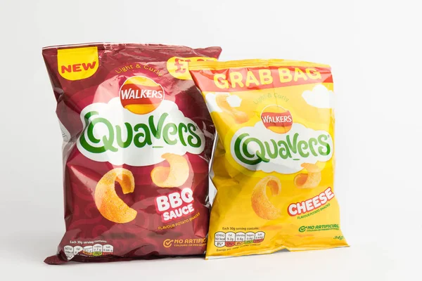 stock image London, United Kingdom, 29th January 2024:- A pair of  packets of  Walkers Quavers British Potato Snacks on a white background