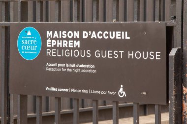 Paris, France, Apirl 20th 2024:- A view of a sign for the Religious Guest House, Maison D'Accueil Ephrem by the Sacre-Coeur on Montmartre clipart