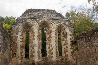 Tall arched windows at The Ruins of Waverley Abbey, located near Farnham, Surrey UK. This was the first Cistercian Abbey in England clipart