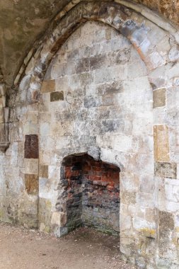 A fire place inside the Ruins of Waverley Abbey, located near Farnham, Surrey UK. This was the first Cistercian Abbey in England clipart