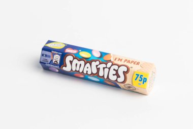 London, United Kingdom, 24th September 2024:- A view of the confectionary Smarties in a paper tube, against a white background