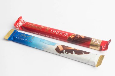 London, United Kingdom, 26th September 2024:- A view of A Lindt Lindor and Lint Classic Chocolate Bars,  against a white background clipart