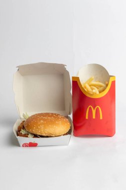 London, United Kingdom, 12th November 2024:- A view of a McDonalds Vegetable Deluxe and Large Fries, against a White background