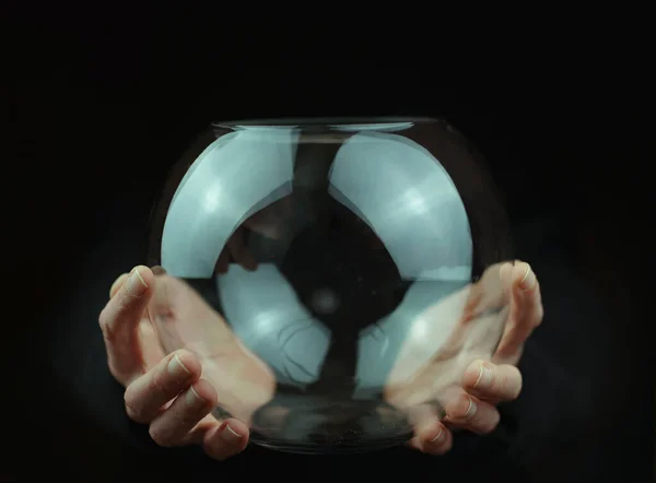 transparent glass ball in hands . High quality photo