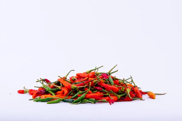 Chili on the white background. Spicy ingredients to add heat to your food
