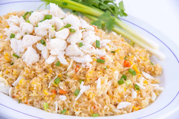 The best thai food dishes you must eat. Crab fried rice on the white dish.