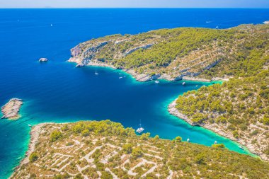 Aerial view of the southern coast of Solta Island, Croatia, showcasing its rugged coastline, hidden coves, crystal-clear turquoise waters, and pristine beaches, making it a perfect destination for yachting, sailing, and summer relaxation. clipart