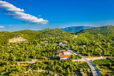 A stunning aerial view of Blato na Cetini in the Omi hinterland, Croatia, featuring its beautiful natural landscape, winding Cetina River, and traditional village, showcasing the charm of Dalmatia clipart