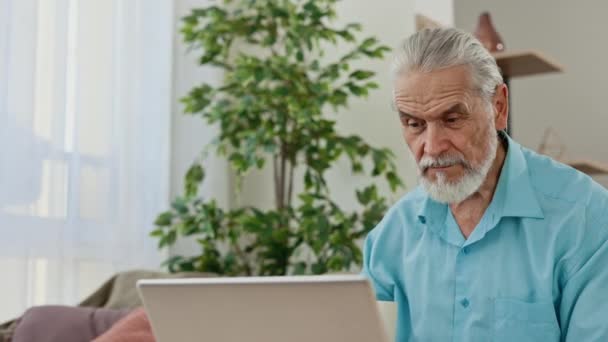 Caucasian Mature Man Working Using Laptop Sitting Living Room Drinking — Video