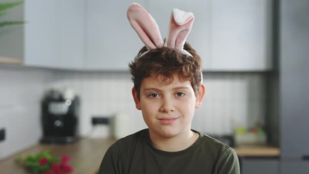 Portrait Smiling Little Boy Wearing Bunny Ears Headband Sitting Kitchen — Stockvideo