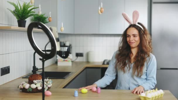 Smiling Female Influencer Talking Easter Eggs Coloring Video Blog Home — Stockvideo