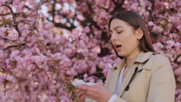 Caucasian Woman Casual Wear Sneezing Tissue While Standing Outdoors Blooming — Stockvideo