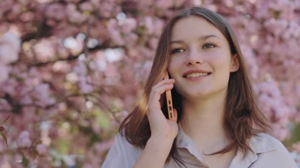 Charming Young Caucasian Woman Enjoying Pleasant Mobile Conversation Talking Smartphone — стоковое видео