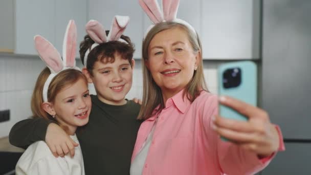 Happy Grandmother Grandchildren Doing Selfie Easter Eggs Wearing Bunny Ears — Wideo stockowe