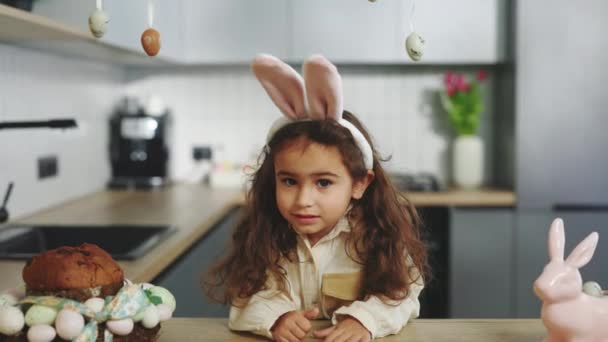 Portrait Beautiful Little Girl Wearing Bunny Ears Headband Sitting Kitchen — Stock video