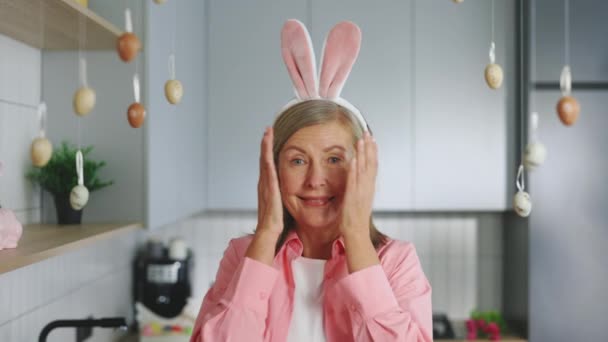 Portrait Smiling Senior Lady Wearing Bunny Ears Headband Playing Peek — Video