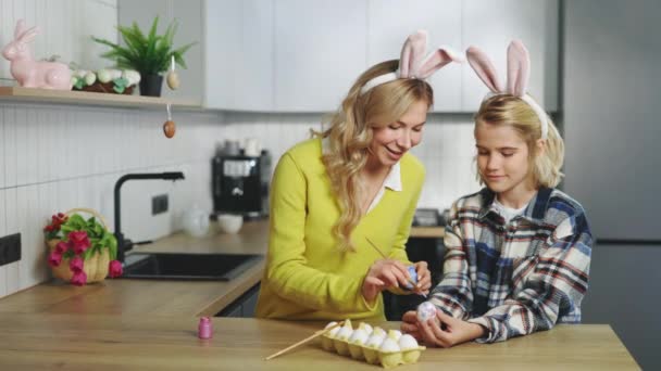 Smiling Mother Son Kitchen Sitting Painting Eggs Traditional Spring Easter — Stock video
