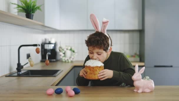 Happy Little Boy Wearing Rabbit Ears Sitting Kitchen Table Eating — Stock video