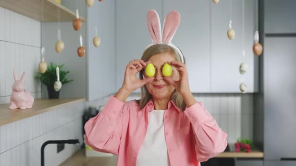 Funny Senior Woman Rabbit Ears Her Head Standing Decorated Kitchen — Vídeo de Stock