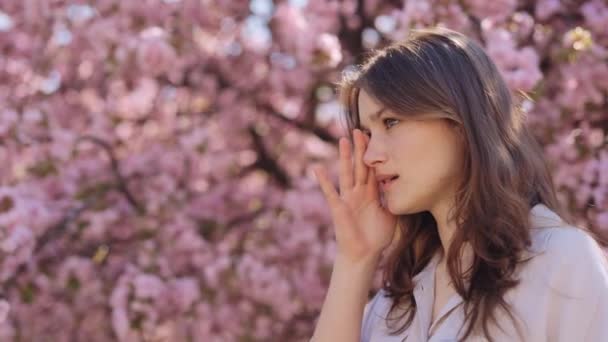 Young Woman Standing Outdoors Rubbing Eyes Because Allergy Pollen Spring — Stock Video