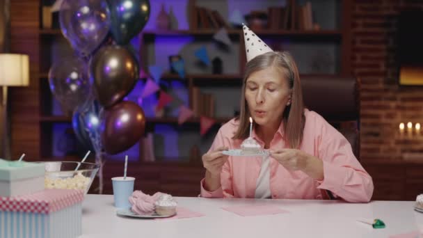Lonely Elderly Woman Blowing Candle Piece Cake Celebrating Birthday Alone — Stockvideo