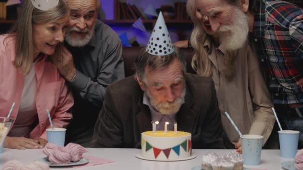 Happy Funny Senior Man Birthday Hat Blowing Out Candle Birthday — Vídeo de stock