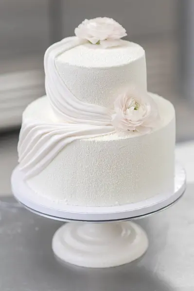 process making white wedding cake decorating layered