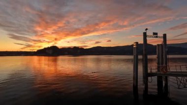 sunset at the lake with red clouds