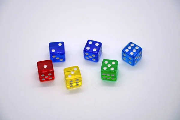 Colorful dice isolated on a white background showing numbers one through six