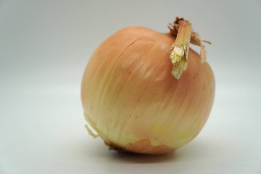 Close up of whole yellow vidalia onion isolated on a white background