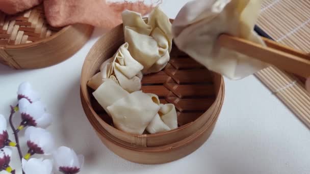 Woman Hand Puts Raw Dumpling Dimsum Bamboo Steamer Traditional Food — Stock Video