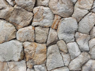 The pattern of rustic natural stone wall..it can be used for background