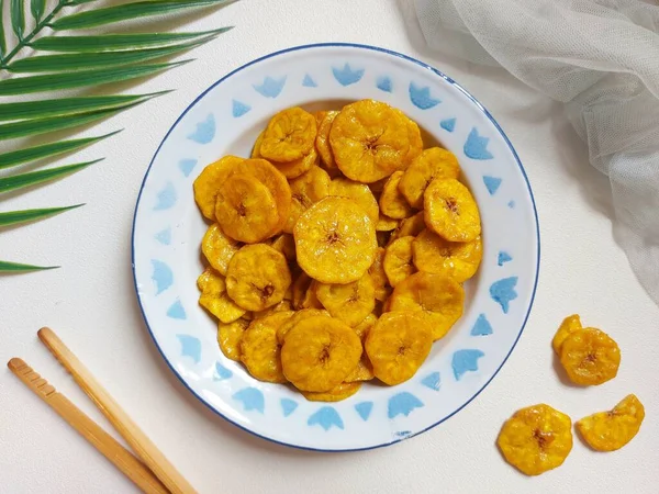 Sweet banana chips. It is traditional snack from indonesia. Made from banana and sugar. Sweet and crispy.
