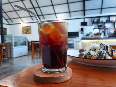 Lychee tea with ice and mint leaf on transparent glass. Refreshing drink. 
