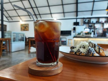 Lychee tea with ice and mint leaf on transparent glass. Refreshing drink. 