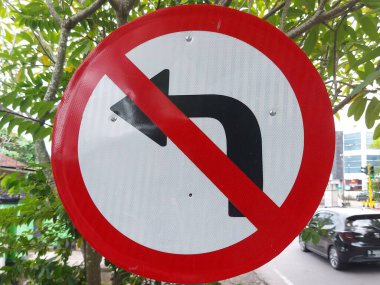 Turn left is prohibited sign on the pole