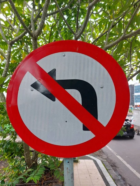 Turn left is prohibited sign on the pole