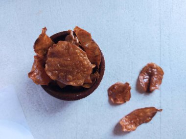 Keripik ubi jalar. It is traditional snack from indonesia. Made from sweet potatoes with palm sugar. Sweet taste and crispy. 