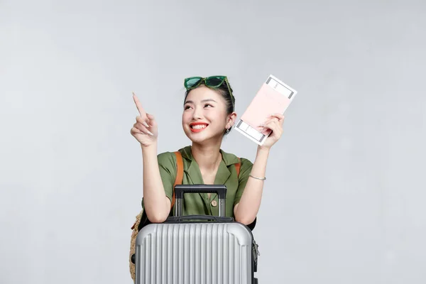 Cheerful woman passport and plane ticket vacation airport