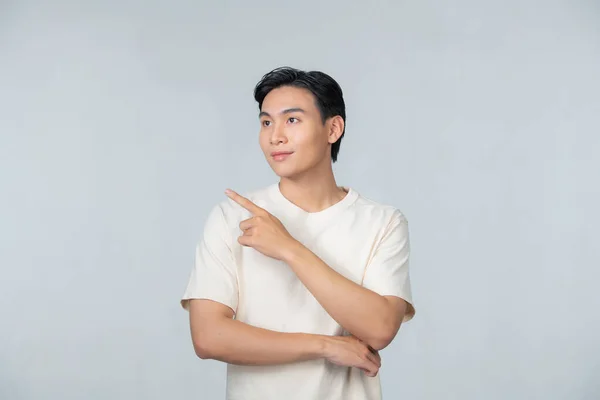 Asian Man Smiling Looking Pointing Left Side — Foto de Stock