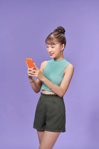 Pretty Millennial Girl Cell Phone Isolated Purple Background — Stock Photo, Image