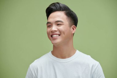 Image of young Asian man posing on background