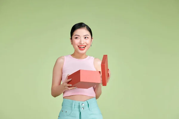 Happy Young Woman Opening Present Valentine Day Green Studio Background — 스톡 사진