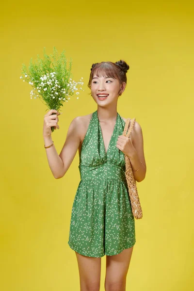 Image Young Asian Woman Holding Flowers Yellow Background — Stock fotografie